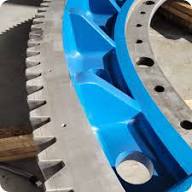 Paint stripped from metal surface by laser showing original substrate underneath